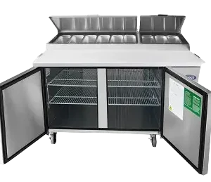Atosa refrigerated pizza prep table with cutting board and open covers and open doors.